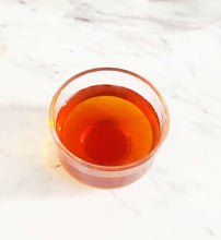 Load image into Gallery viewer, Bowl of brewed Irish Breakfast Tea showcasing its rich amber color.