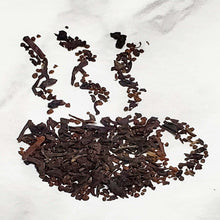 Load image into Gallery viewer, Artful arrangement of loose black tea leaves representing an inviting cup of Irish Breakfast tea.