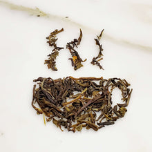 Load image into Gallery viewer, Tea cup-shaped leaves of a tea blend featuring Jasmine green tea , for our Midnight Jasmine Tea