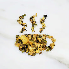 Load image into Gallery viewer, Tea cup-shaped leaves of a tea blend featuring mixture of Ginger root, Peach Pieces and Peppermint , for our digestion Blend Every Thang Peachy