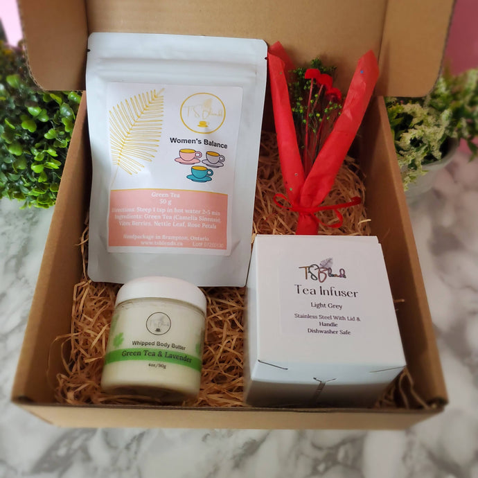 A beautifully packaged self-care gift box featuring a loose-leaf tea blend, a whipped body butter, and a stainless steel tea infuser in a customizable color.

Create your perfect self-care ritual—order your custom gift box today!