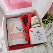 Load image into Gallery viewer, A beautifully packaged self-care gift box featuring a loose-leaf tea blend, a whipped body butter, and a stainless steel tea infuser in a customizable color.

Create your perfect self-care ritual—order your custom gift box today!
